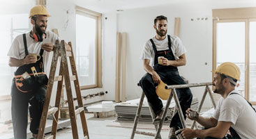 builders talking with coffee in hand